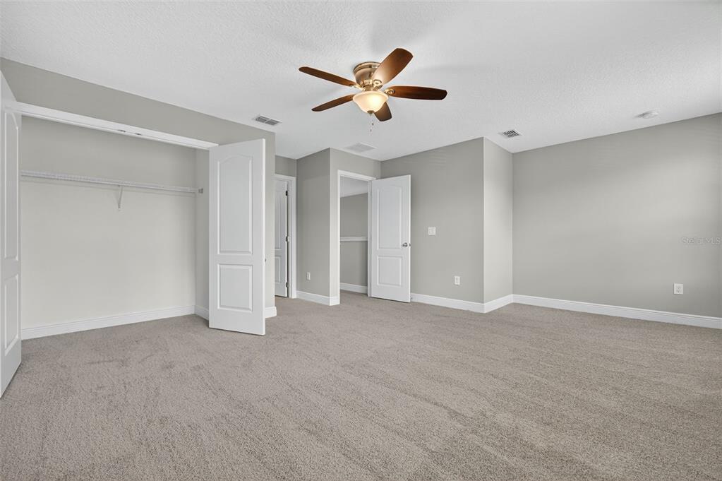 280 Wallrock Drive Ocoee, FL 34761 - Photo 58 of 88 a view of an empty room with a ceiling fan