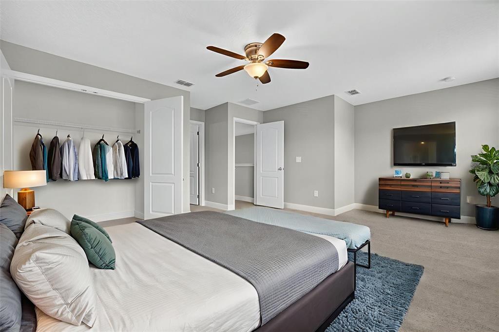 280 Wallrock Drive Ocoee, FL 34761 - Photo 59 of 88 a bedroom with a bed and a television