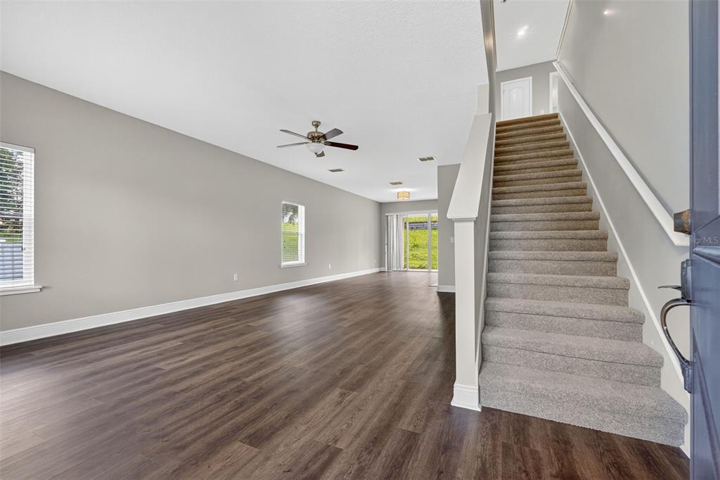 280 Wallrock Drive Ocoee, FL 34761 - Photo 7 of 88 a view of an entryway with wooden floor