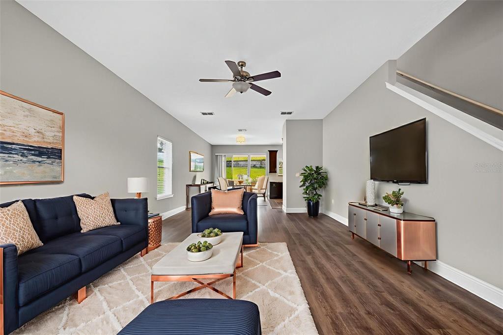 280 Wallrock Drive Ocoee, FL 34761 - Photo 9 of 88 a living room with furniture and a flat screen tv