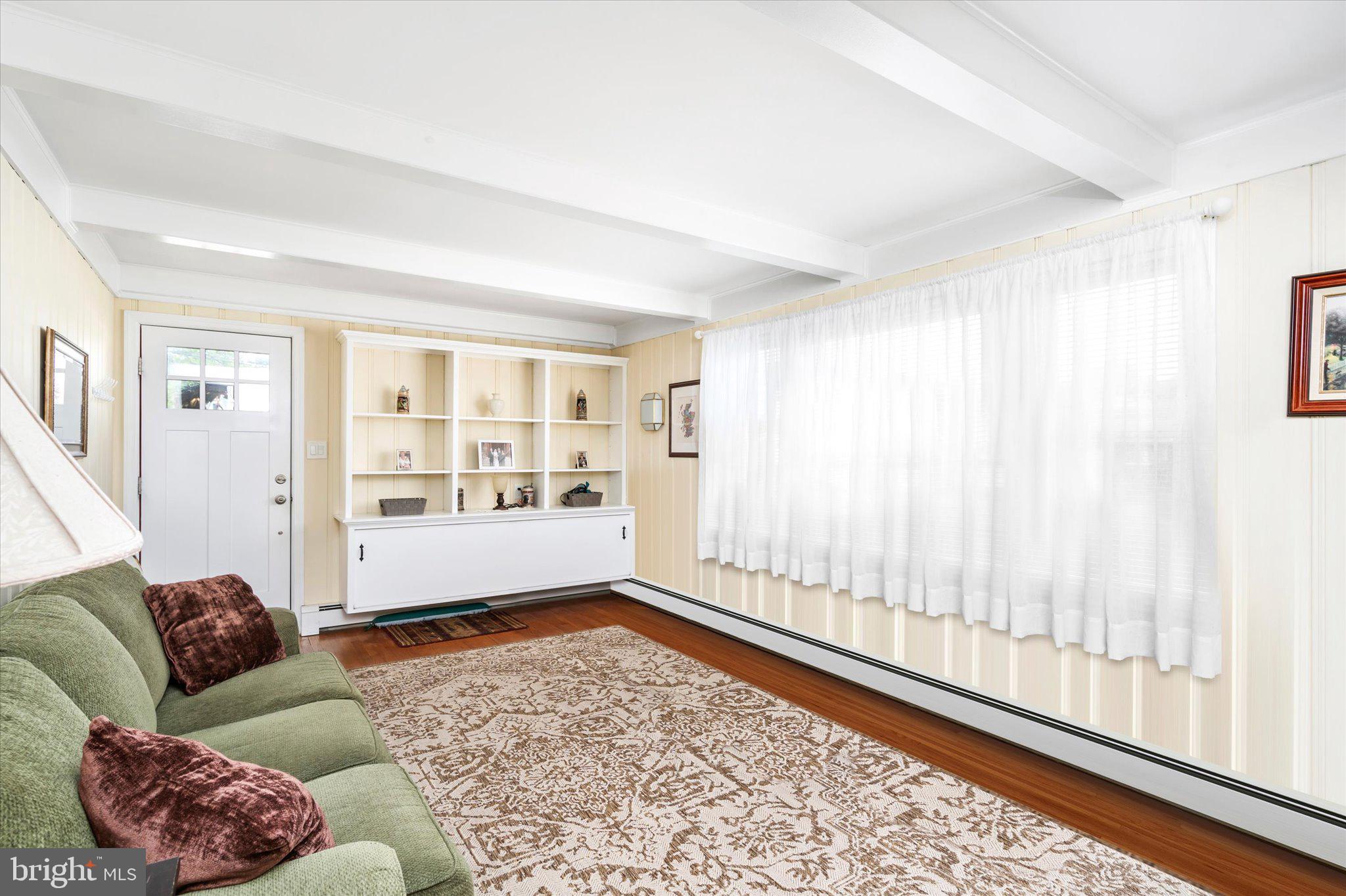 158 Coleman Road Hamilton, NJ 08690 - Photo 11 of 32 a living room with furniture and a floor to ceiling window