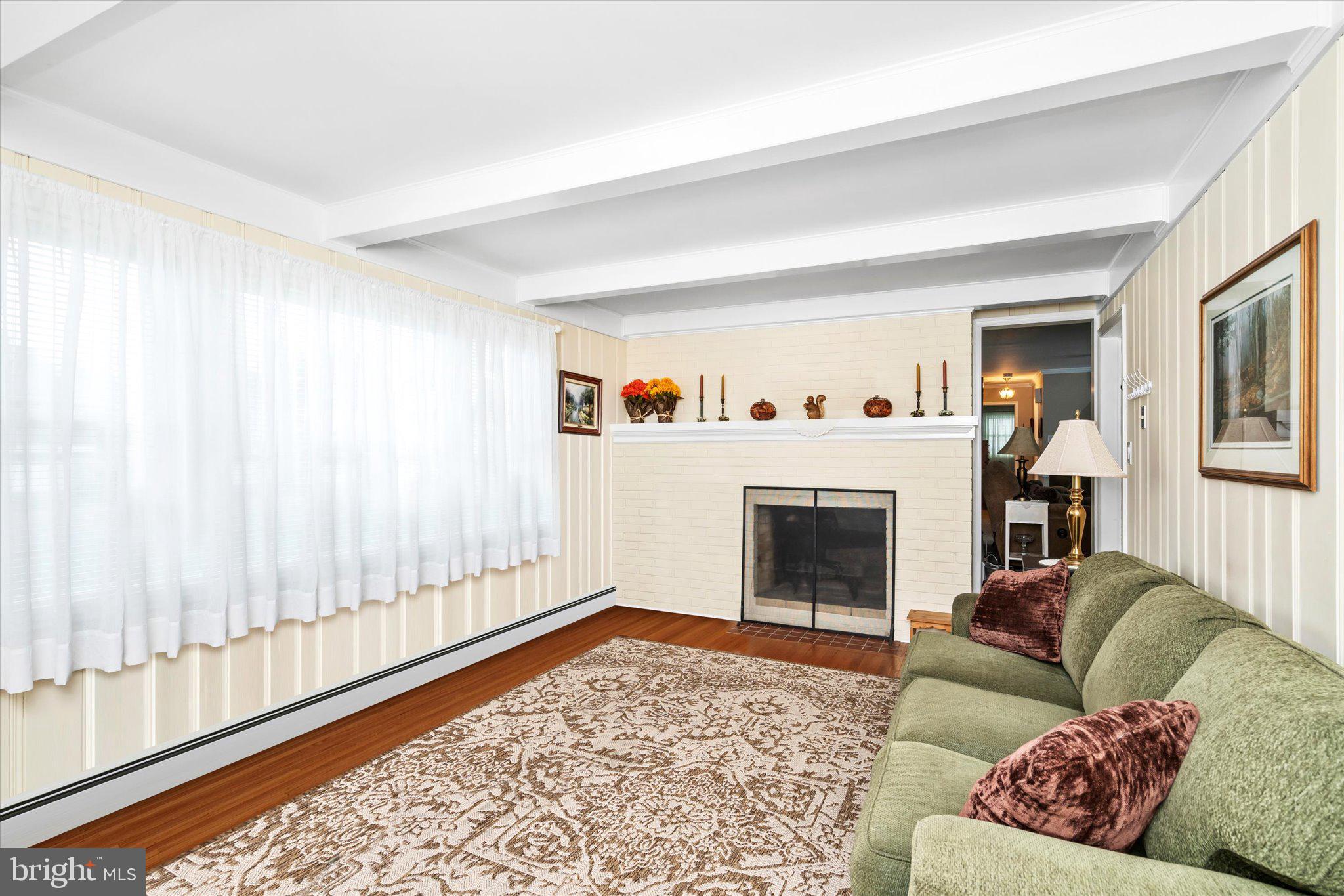 158 Coleman Road Hamilton, NJ 08690 - Photo 12 of 32 a living room with furniture and a fireplace
