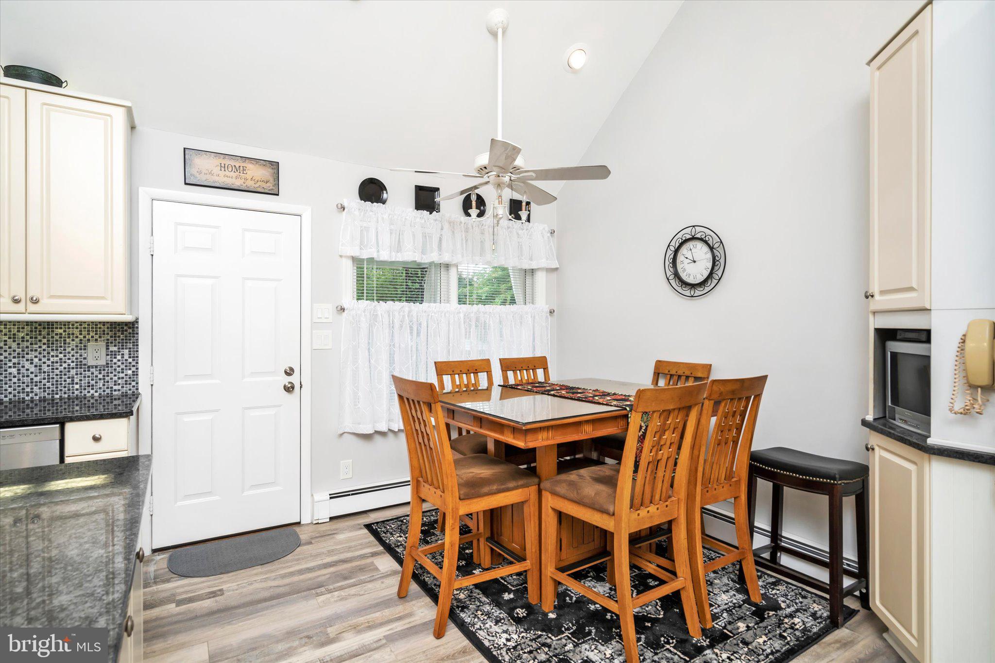 158 Coleman Road Hamilton, NJ 08690 - Photo 14 of 32 a view of a dining room with furniture and a chandelier
