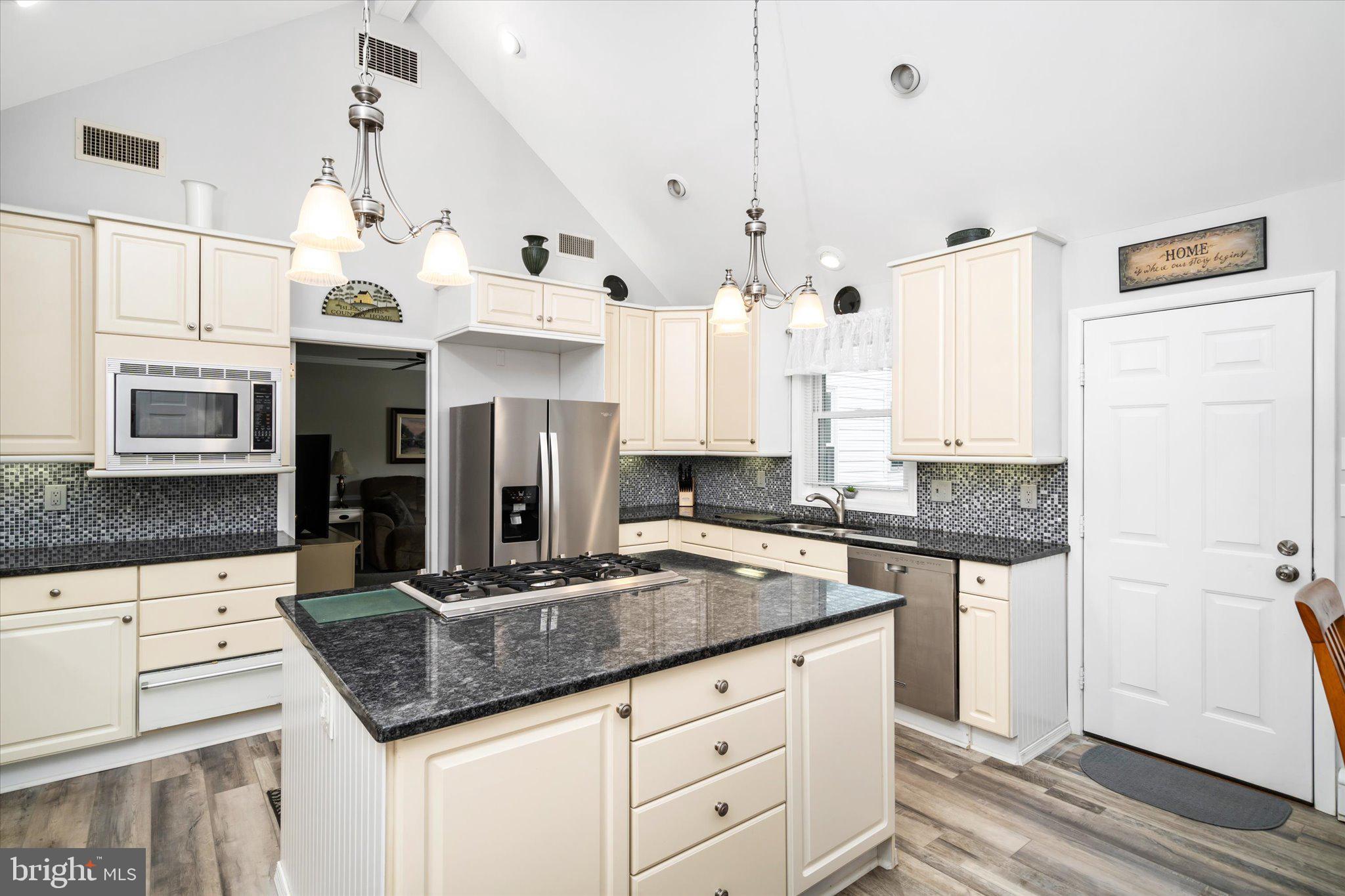 158 Coleman Road Hamilton, NJ 08690 - Photo 15 of 32 a kitchen with stainless steel appliances granite countertop a sink stove and refrigerator