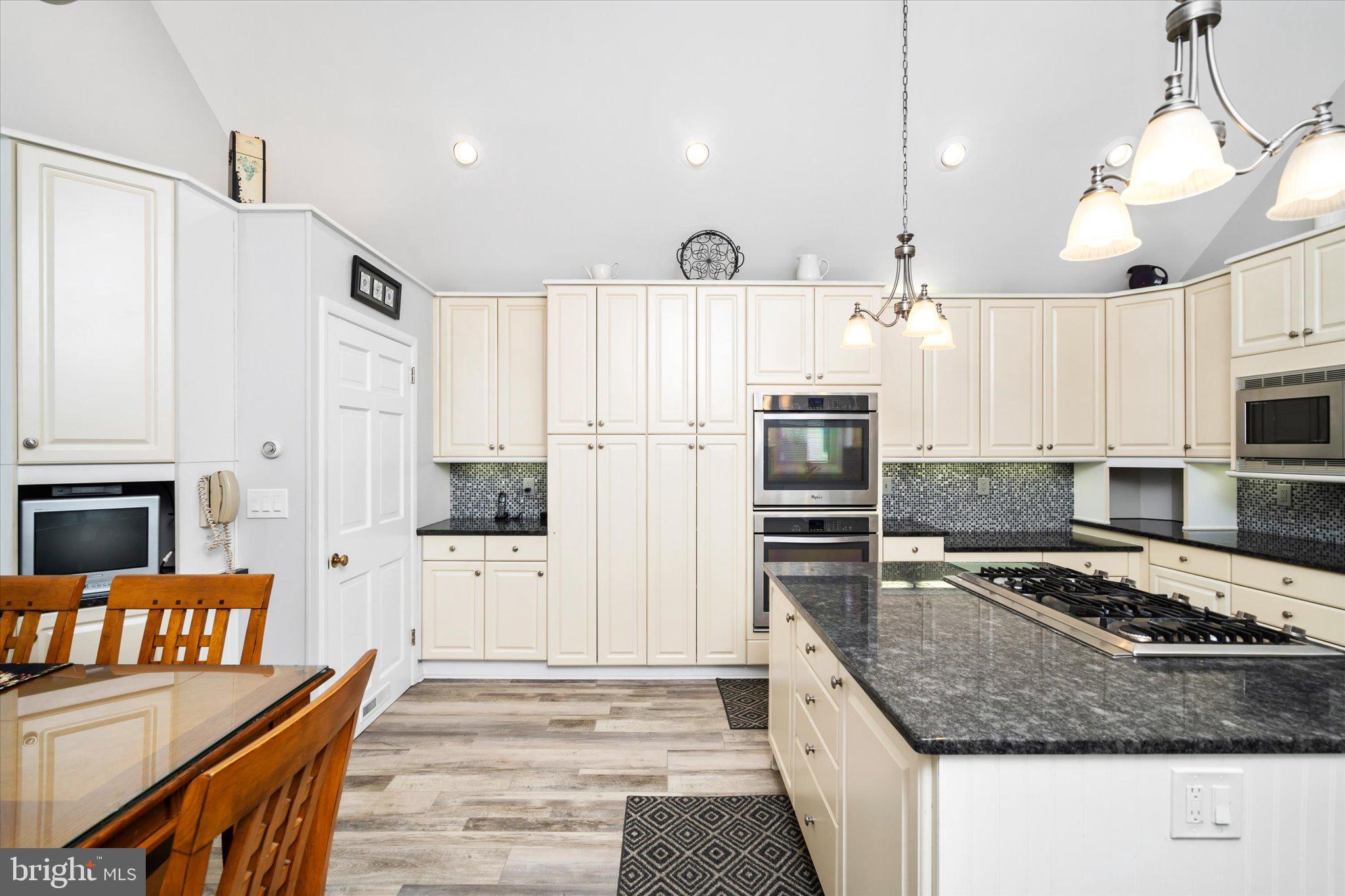 158 Coleman Road Hamilton, NJ 08690 - Photo 16 of 32 a kitchen with stainless steel appliances granite countertop a refrigerator stove microwave and sink