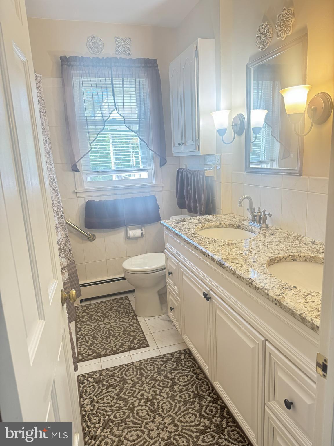 158 Coleman Road Hamilton, NJ 08690 - Photo 17 of 32 a bathroom with a granite countertop sink a toilet a mirror and bathtub