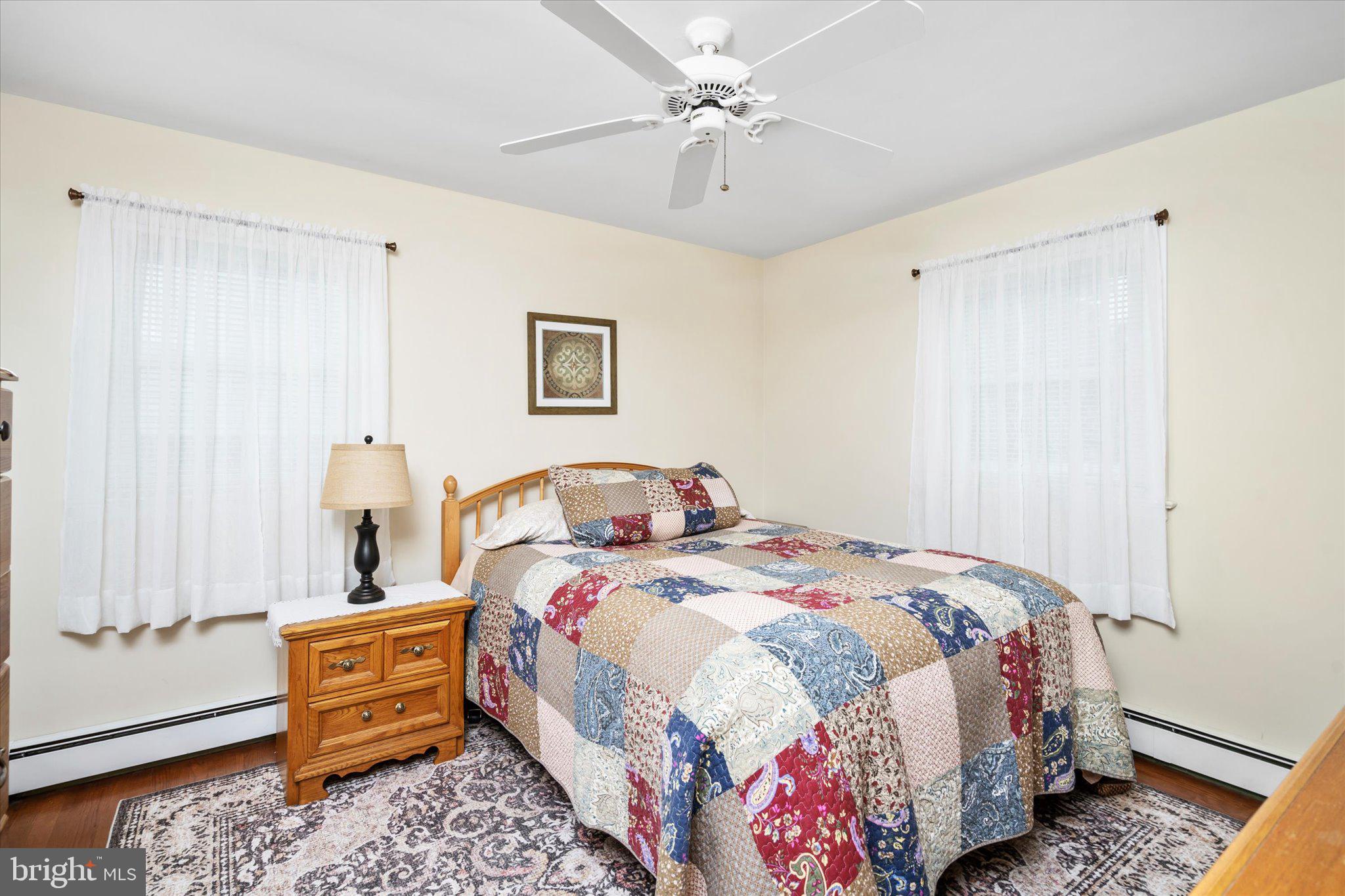 158 Coleman Road Hamilton, NJ 08690 - Photo 18 of 32 a bedroom with a bed and a chandelier