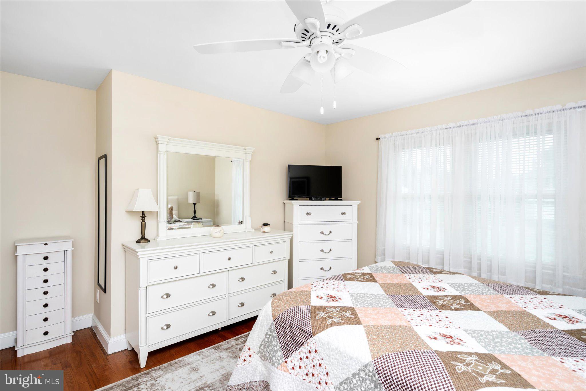 158 Coleman Road Hamilton, NJ 08690 - Photo 20 of 32 a bedroom with a bed and a flat tv screen tv