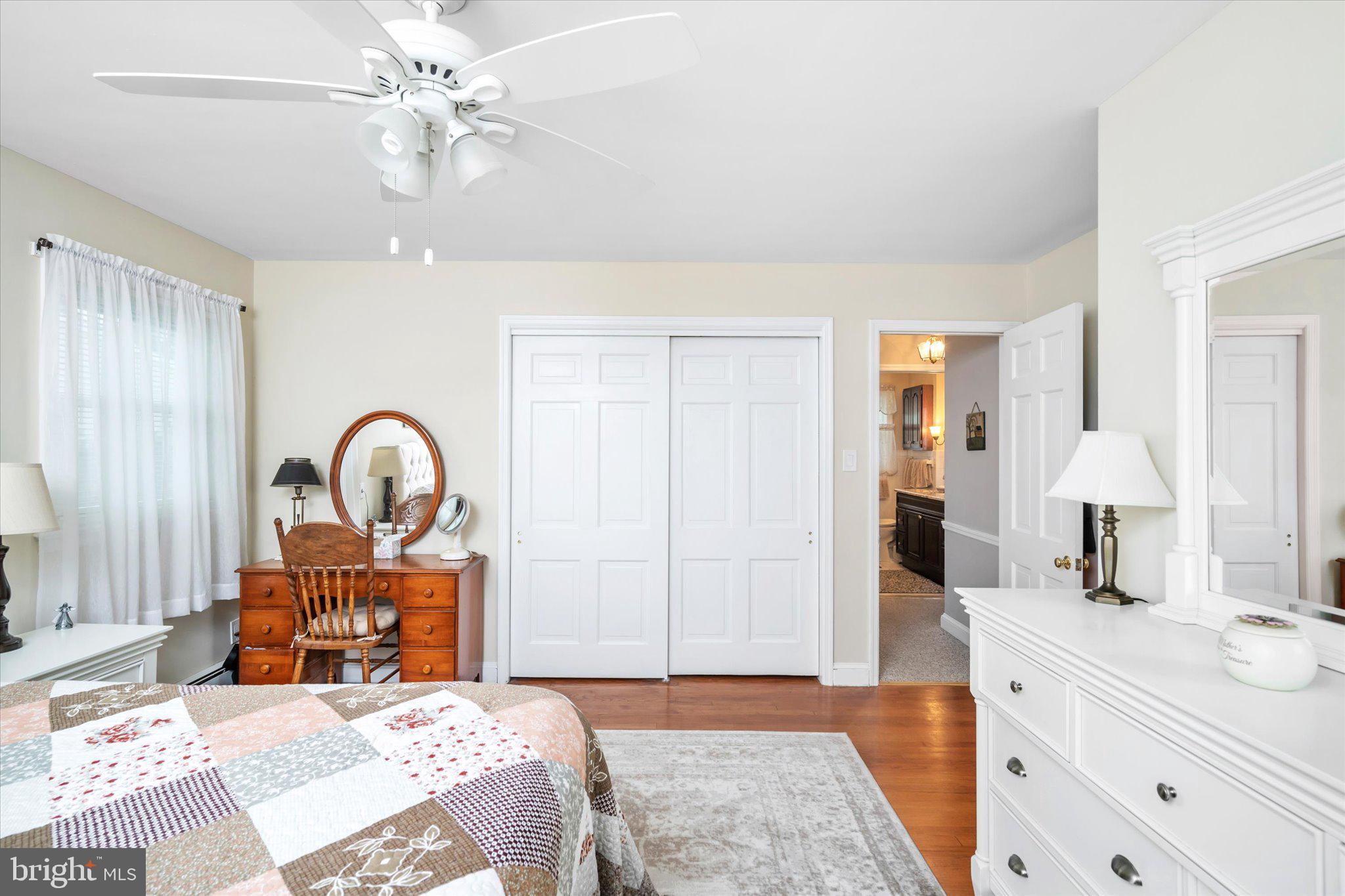 158 Coleman Road Hamilton, NJ 08690 - Photo 21 of 32 a spacious bedroom with a bed and a chandelier