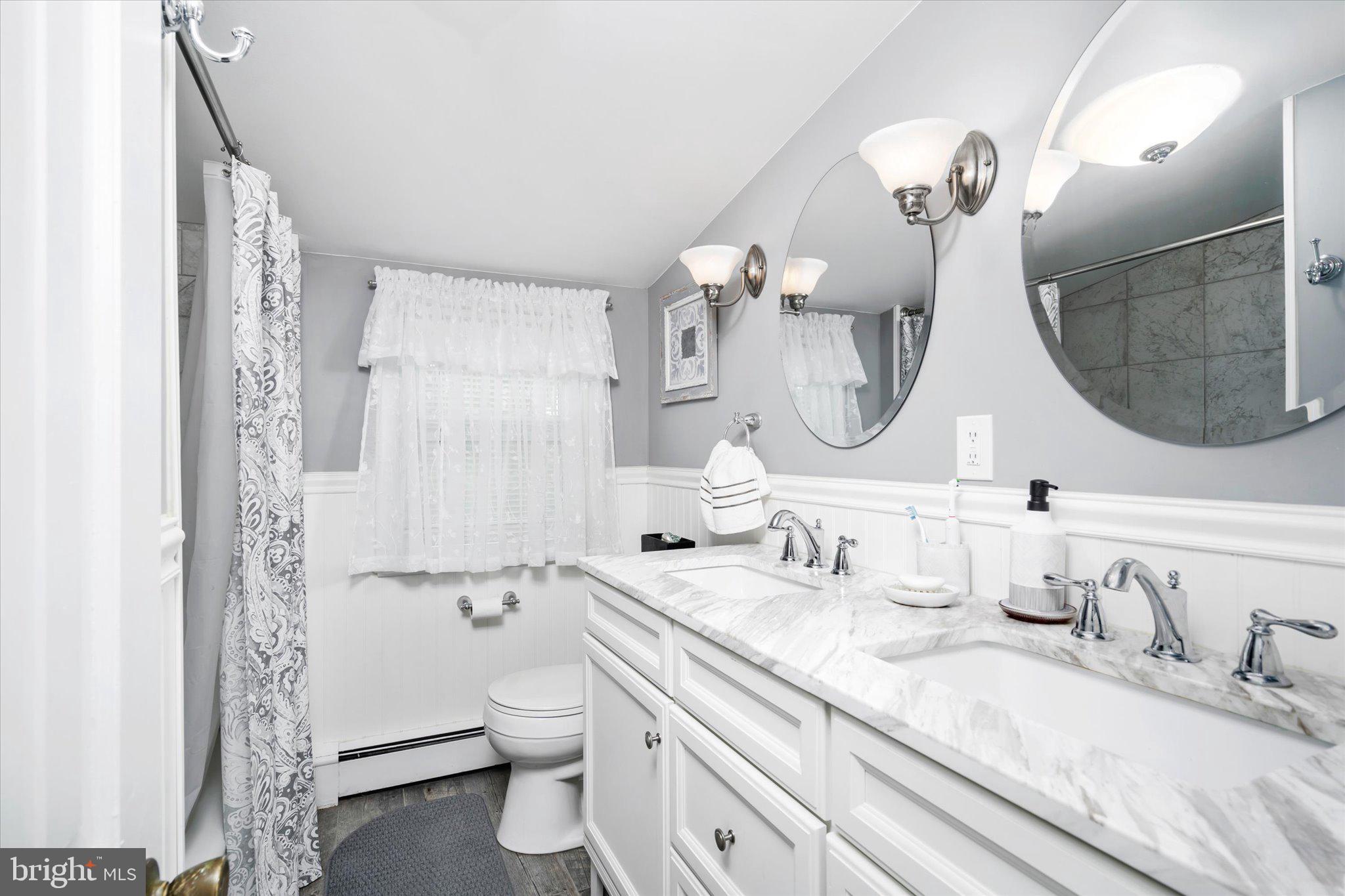 158 Coleman Road Hamilton, NJ 08690 - Photo 24 of 32 a bathroom with a double vanity sink mirror and toilet