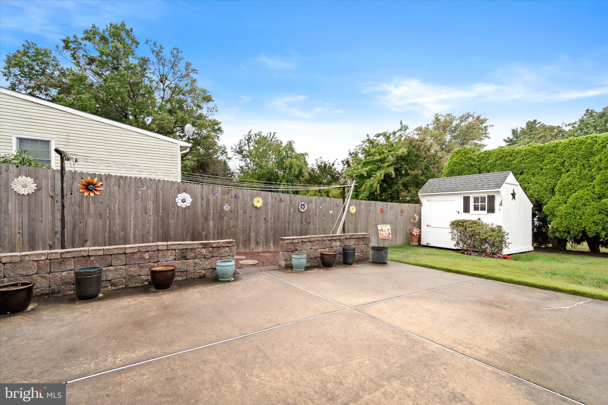 158 Coleman Road Hamilton, NJ 08690 - Photo 30 of 32 a backyard of a house with fire pit and furniture