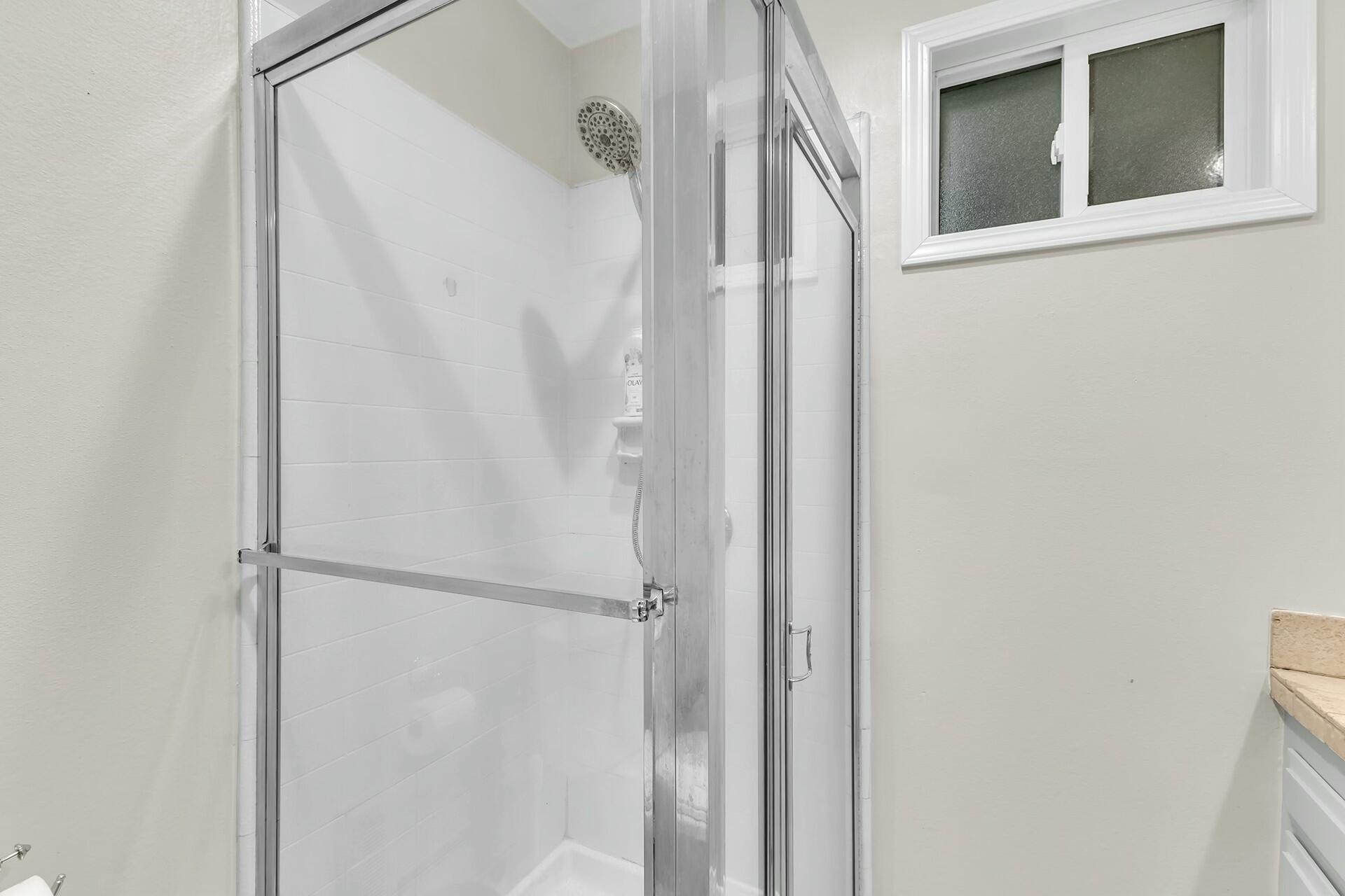 25622 Double Tree Drive Idyllwild, CA 92549 - Photo 36 of 65 a bathroom with a glass shower door