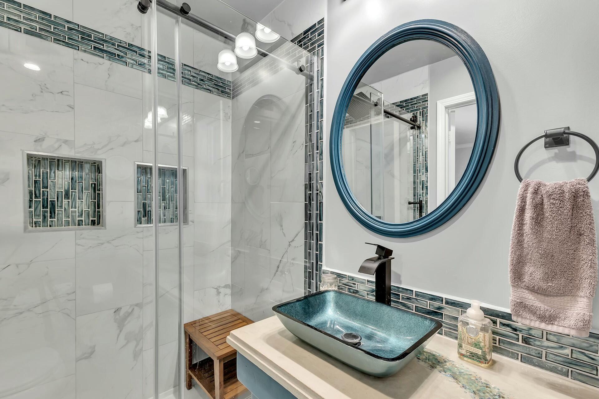 25622 Double Tree Drive Idyllwild, CA 92549 - Photo 43 of 65 a bathroom with a sink a mirror and a shower
