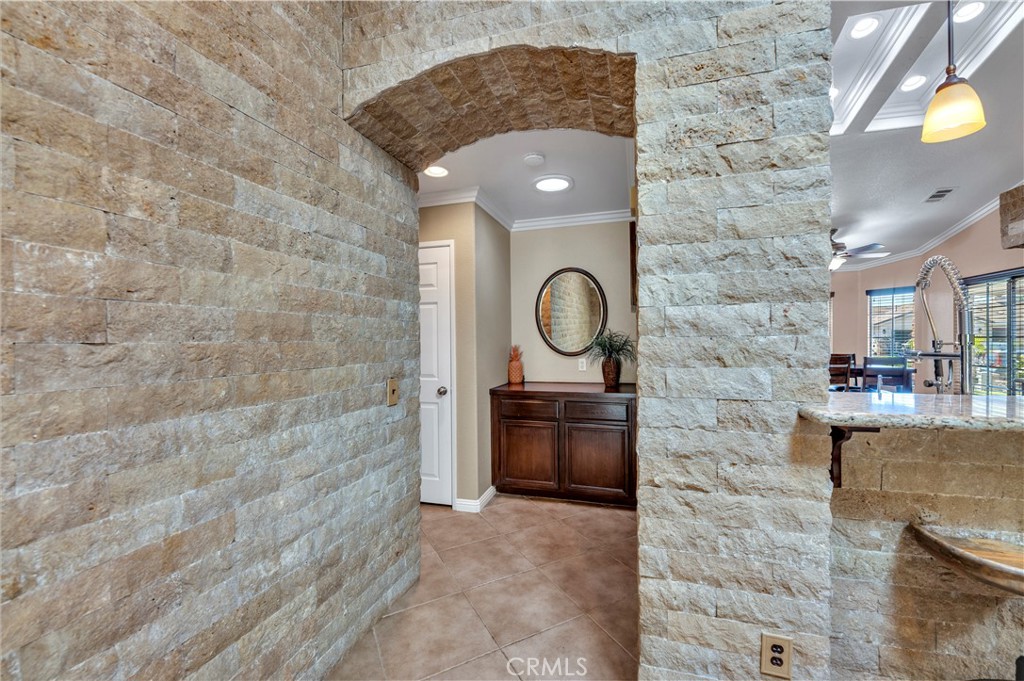 31584 Adour Way Winchester, CA 92596 - Photo 20 of 51 a bathroom with a granite countertop sink a mirror and vanity