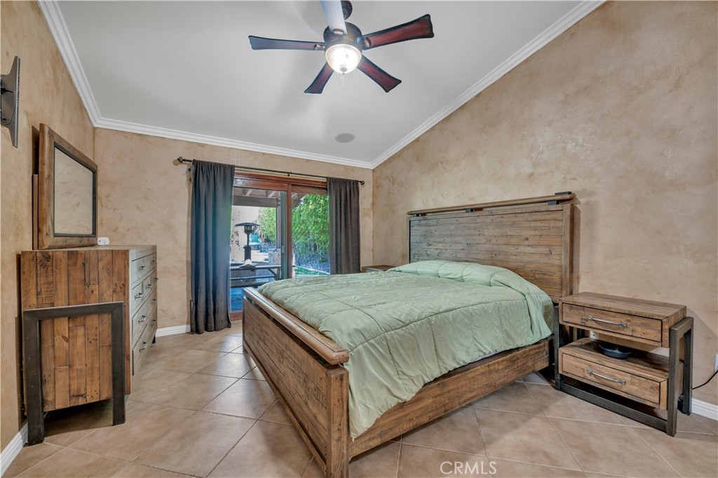 31584 Adour Way Winchester, CA 92596 - Photo 21 of 51 a bedroom with a bed and a refrigerator