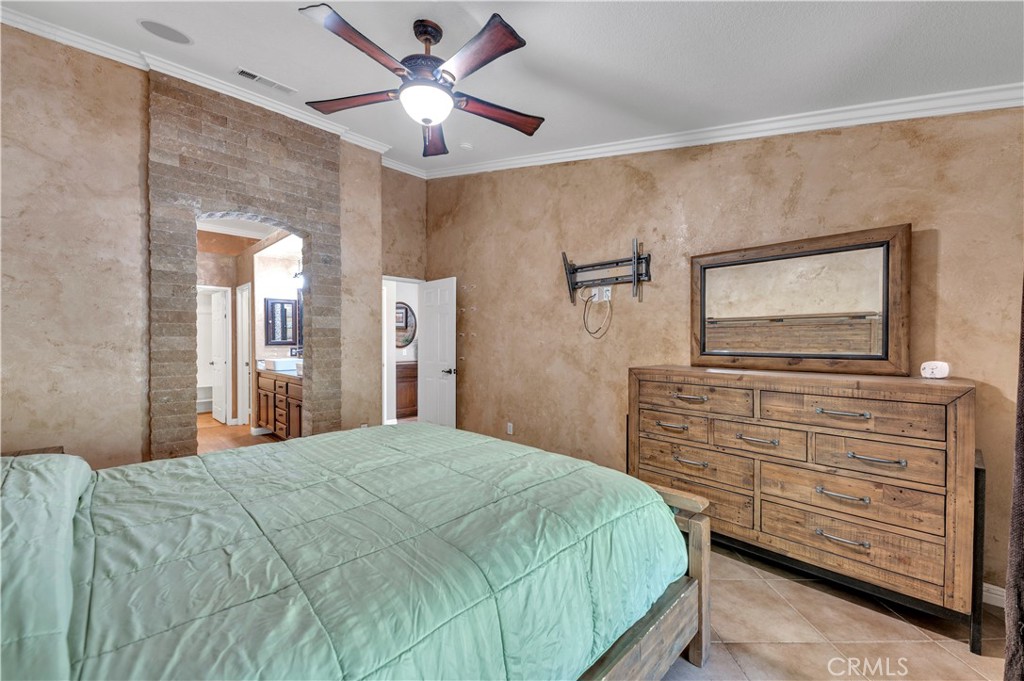 31584 Adour Way Winchester, CA 92596 - Photo 22 of 51 a bedroom with a bed and a flat screen tv