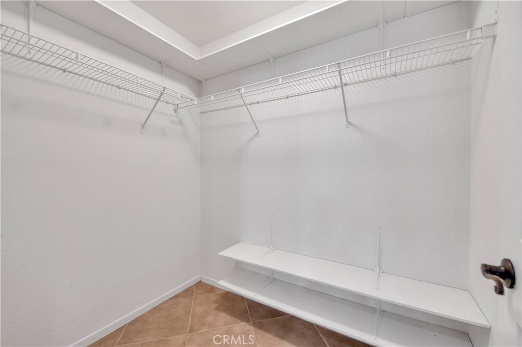 31584 Adour Way Winchester, CA 92596 - Photo 26 of 51 a bathroom with a shower and a bath tub