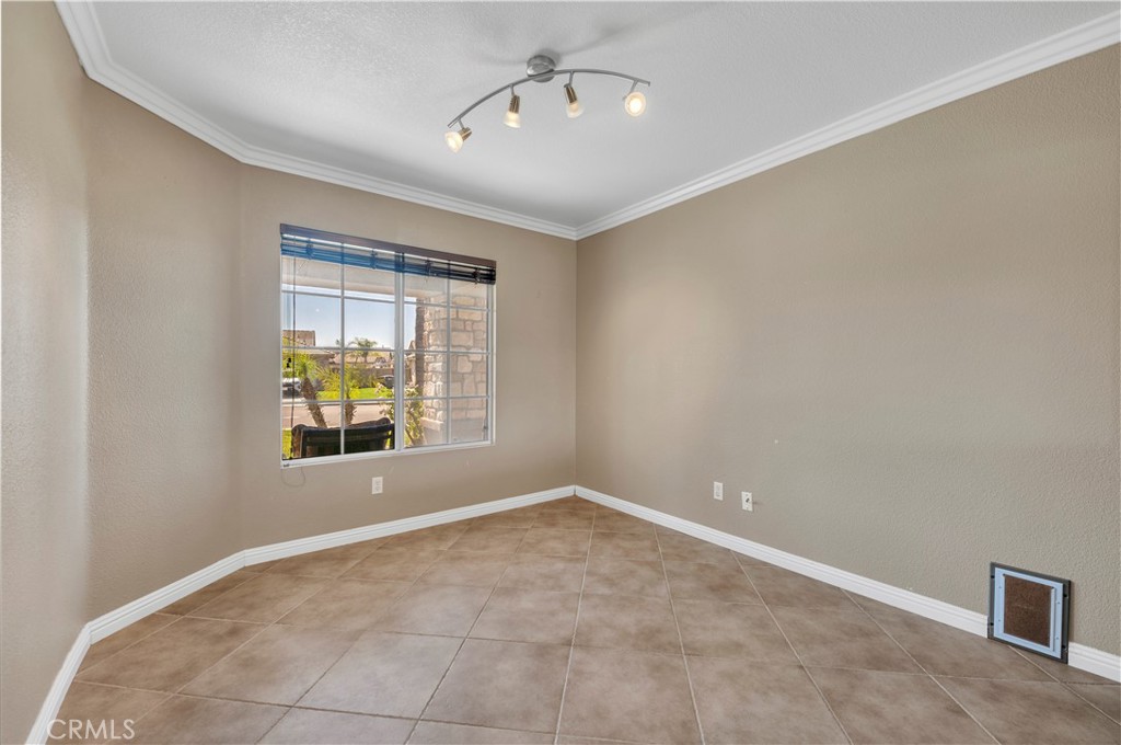 31584 Adour Way Winchester, CA 92596 - Photo 27 of 51 a view of an empty room with a window