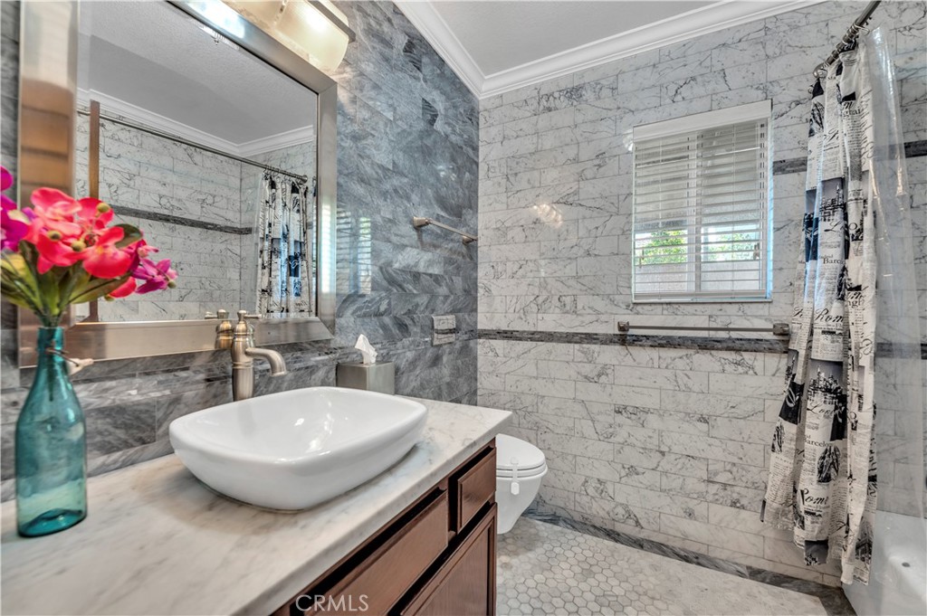 31584 Adour Way Winchester, CA 92596 - Photo 28 of 51 a bathroom with a sink and a mirror