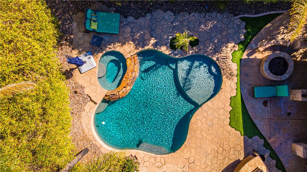 31584 Adour Way Winchester, CA 92596 - Photo 42 of 51 a view of a swimming pool with sitting area