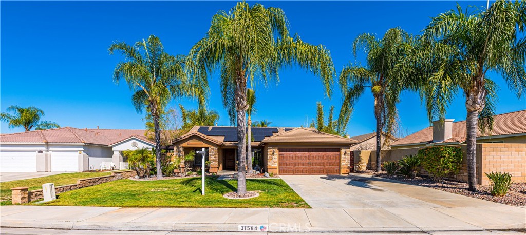 31584 Adour Way Winchester, CA 92596 - Photo 5 of 51 front view of a house with a yard and potted plants