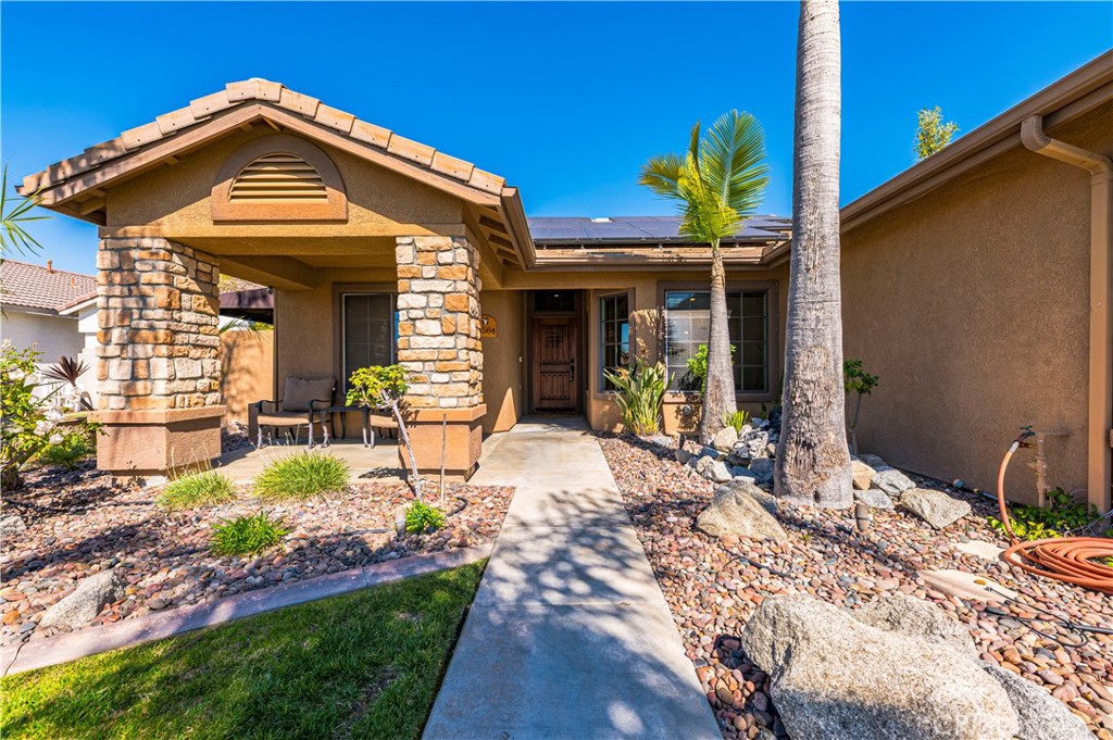 31584 Adour Way Winchester, CA 92596 - Photo 10 of 51 a front view of a house with a yard