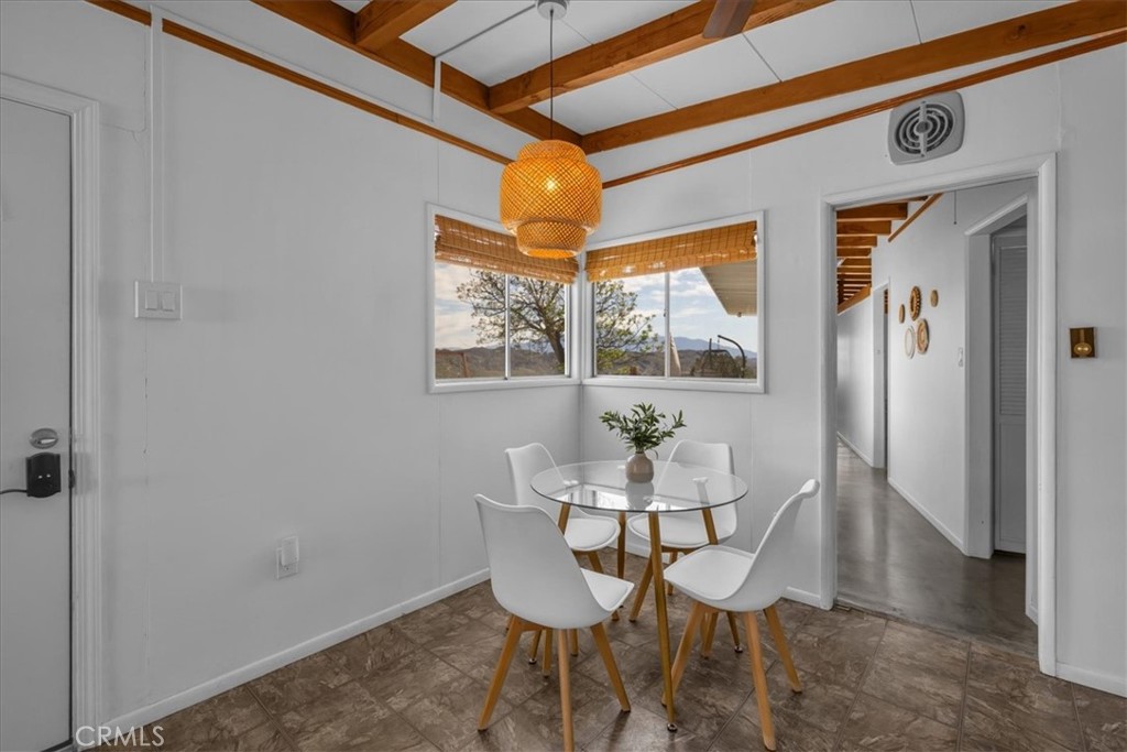 8500 South Samel Road Morongo Valley, CA 92256 - Photo 15 of 75 a dining room with furniture and window