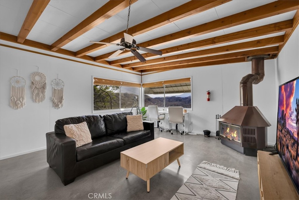 8500 South Samel Road Morongo Valley, CA 92256 - Photo 19 of 75 a living room with furniture and a chandelier