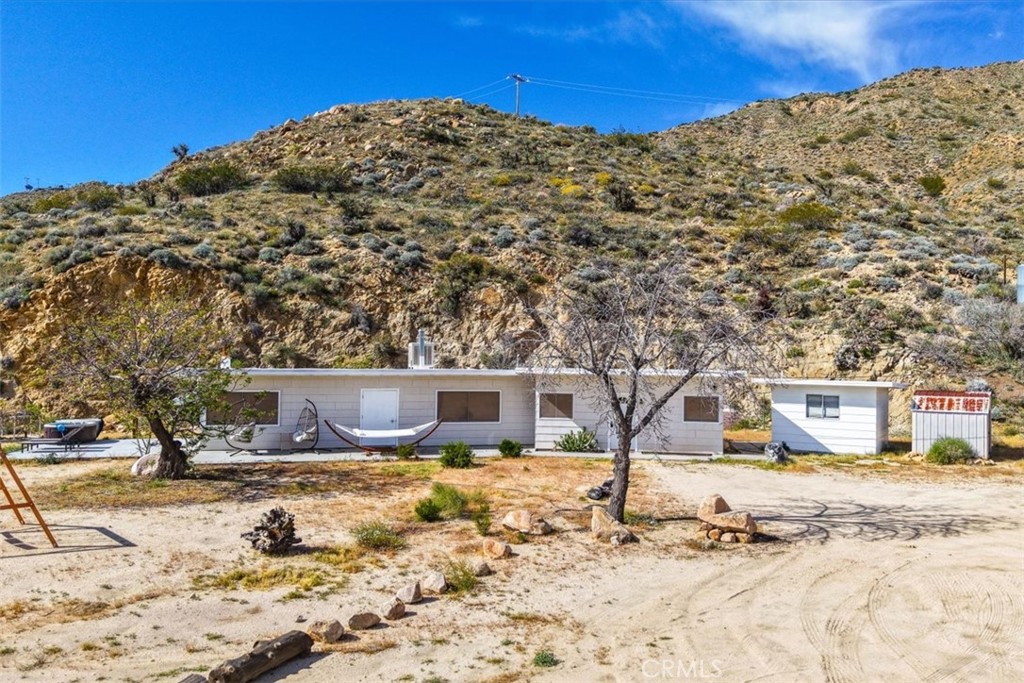 8500 South Samel Road Morongo Valley, CA 92256 - Photo 3 of 75 a view of a house with snow on the road