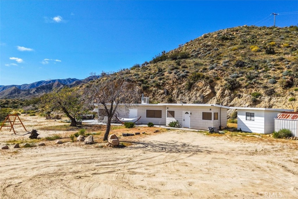 8500 South Samel Road Morongo Valley, CA 92256 - Photo 3 of 75 a view of a house with snow on the background