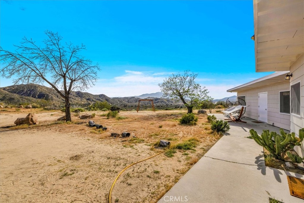 8500 South Samel Road Morongo Valley, CA 92256 - Photo 35 of 75 a view of a yard with an ocean view