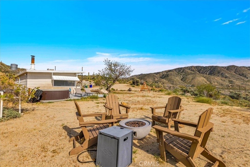 8500 South Samel Road Morongo Valley, CA 92256 - Photo 40 of 75 a view of a terrace with chairs