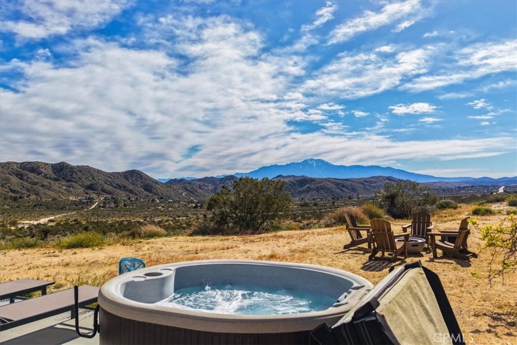 8500 South Samel Road Morongo Valley, CA 92256 - Photo 42 of 75 a view of a swimming pool with a mountain view