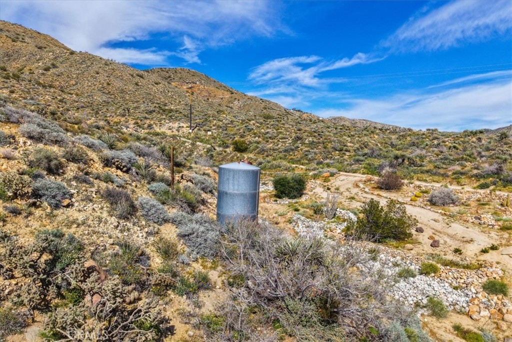 8500 South Samel Road Morongo Valley, CA 92256 - Photo 44 of 75 a view of a large building with a mountain in the background
