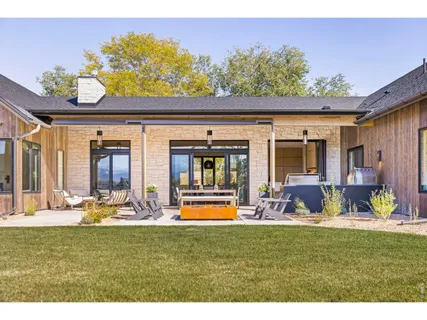 a front view of a house with outdoor seating