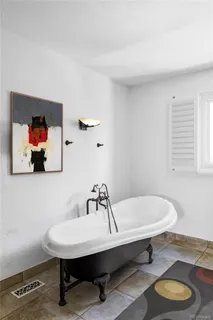 a workspace with wooden floor and a window