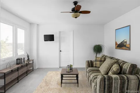 a room with furniture pool table and flat screen tv