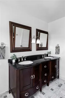 a room with furniture pool table and flat screen tv