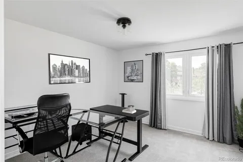 a view of a patio with a table and chairs