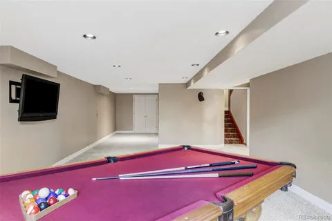 a room with a bed and a television