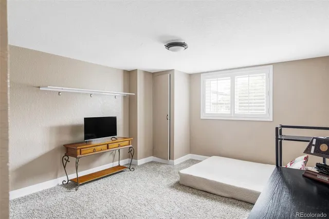 a view of a patio with a table and chairs