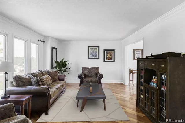 a kitchen with stainless steel appliances granite countertop a stove refrigerator and cabinets