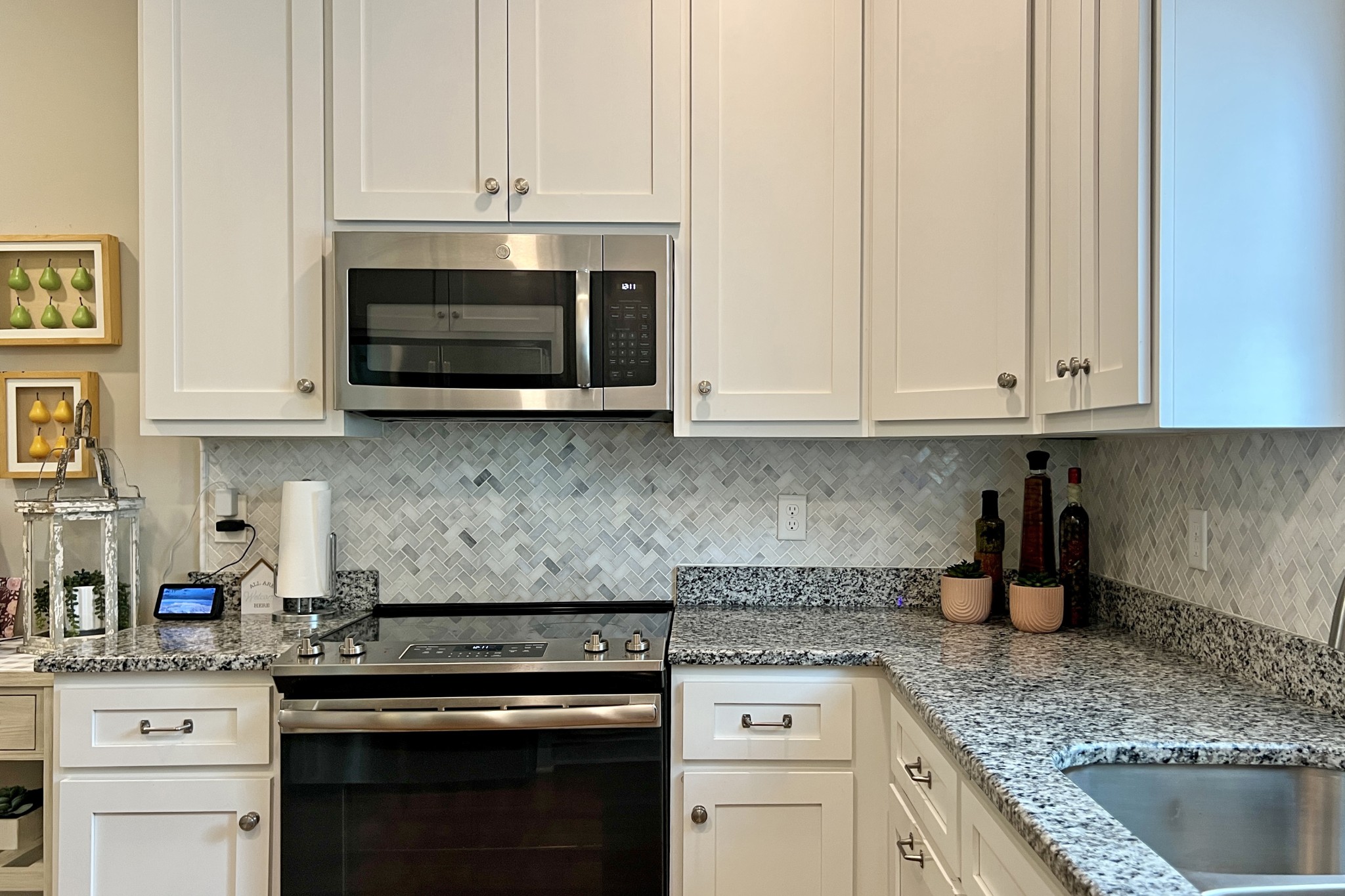 200 Poplar Street Franklin, KY 42134 - Photo 7 of 37 a kitchen with stainless steel appliances granite countertop a stove and a microwave