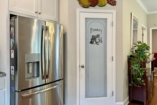 a kitchen with a table and chairs in it