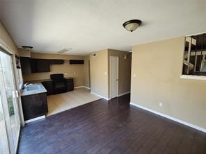 10340 Cook Road, Unit 340 Houston, TX 77099 - Photo 11 of 13 a view of kitchen with refrigerator cabinets and furniture