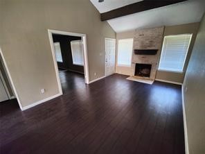 10340 Cook Road, Unit 340 Houston, TX 77099 - Photo 3 of 13 an entryway and livingroom with fireplace