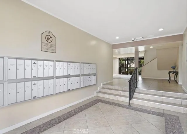 a utility room with cabinets washer and dryer