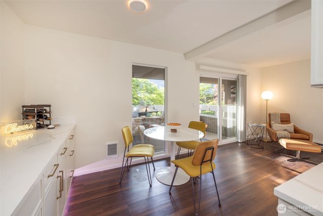 a kitchen with stainless steel appliances white cabinets and a refrigerator