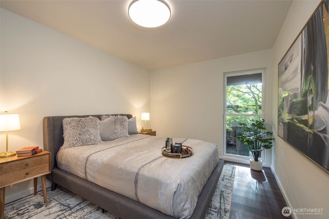 a bed room with a bed and a lamp