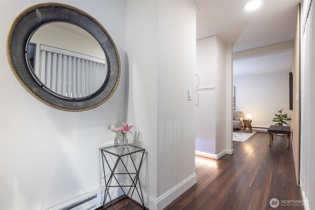 a backyard of a house with lots of green space and a fountain